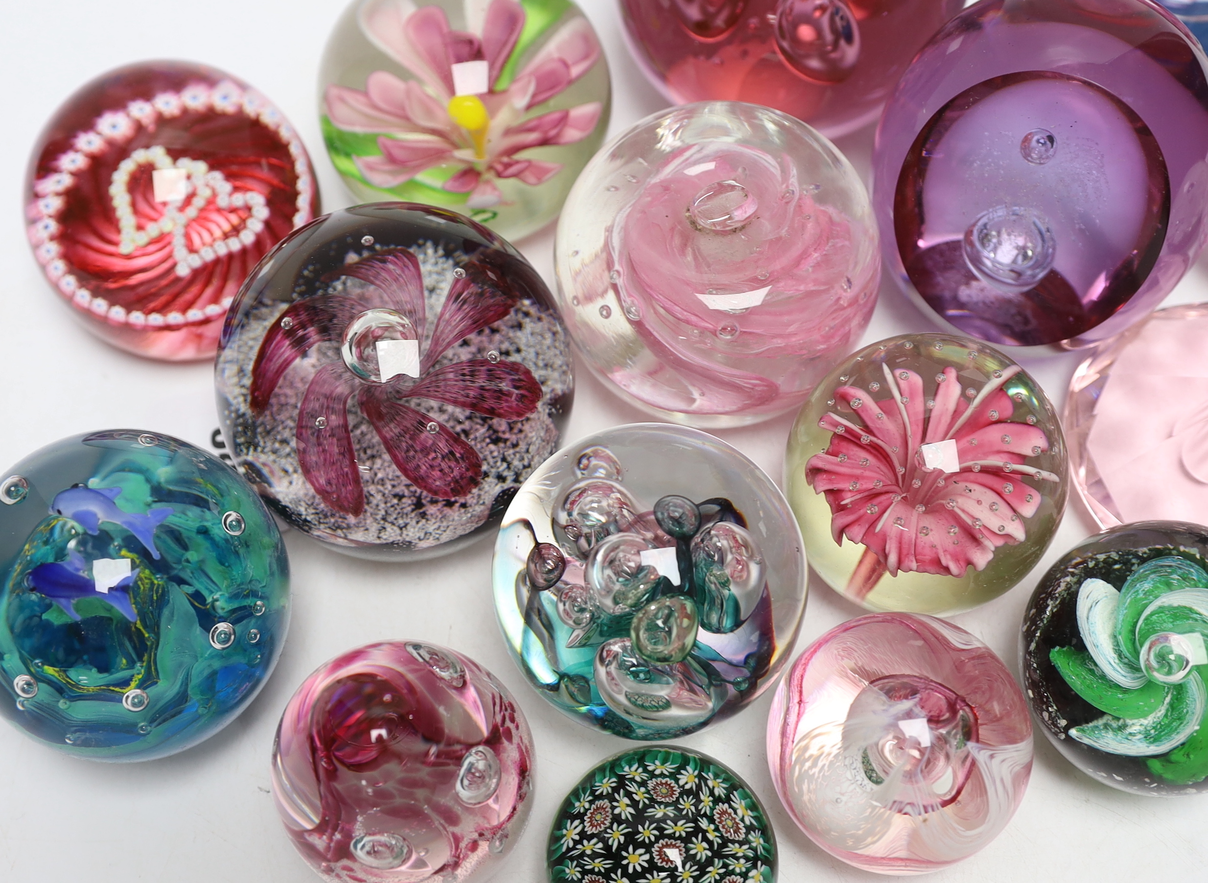 A group of glass paperweights including Caithness